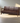 Leather Effect Fabric Upholstered and Walnut Brown Finished Wood Sofa