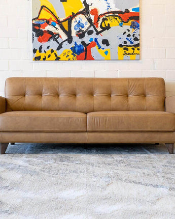 Luxurious Allison Cognac Leather Sofa featuring classic tufted detailing and deep brown hue.