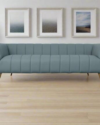 Side view of the LaMattina channel tufted sofa showcasing sleek contours.