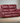 Camila Upholstered Motion Reclining Loveseat Red Faux Leather