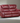 Camila Upholstered Motion Reclining Loveseat Red Faux Leather