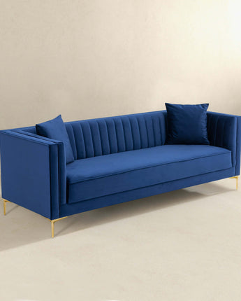 Angelina elegant dark blue sofa featuring a plush velvet finish.