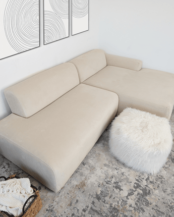 Cream-colored Mar Right sectional sofa with a sleek, modern design.