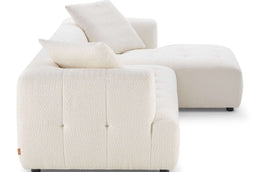 Comfortable boucle sectional with deep seating and rounded edges.