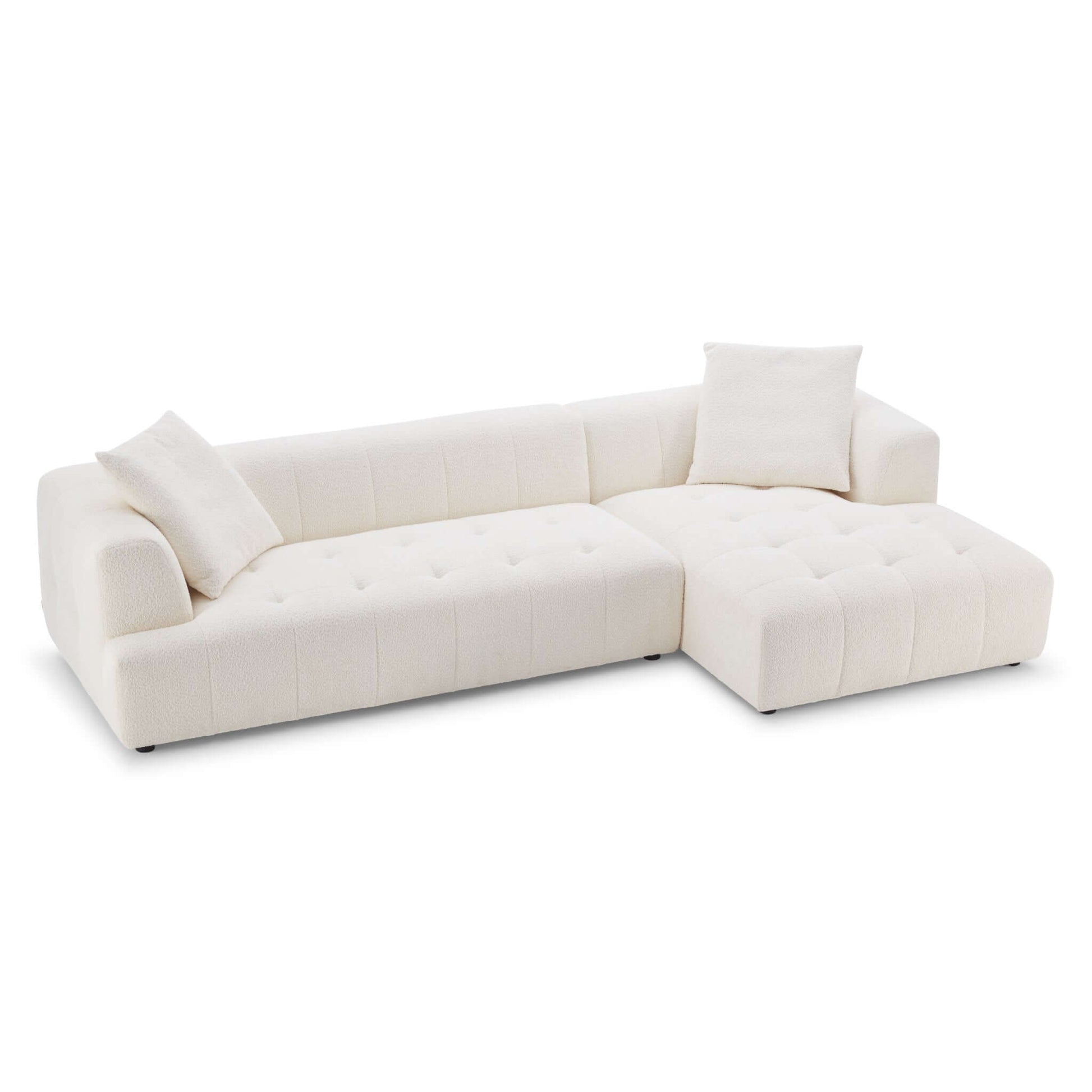 Contemporary boucle sectional in neutral beige tones.