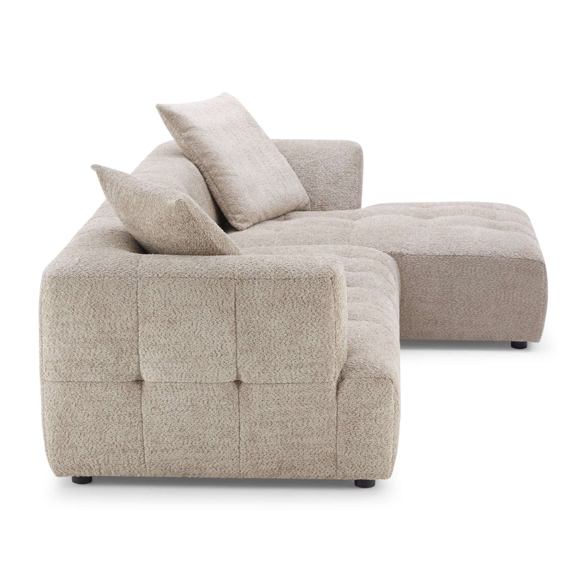 Sleek boucle sectional perfect for a mid-century modern living room.