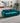 Anthony modern teal sofa with a sophisticated velvet texture.