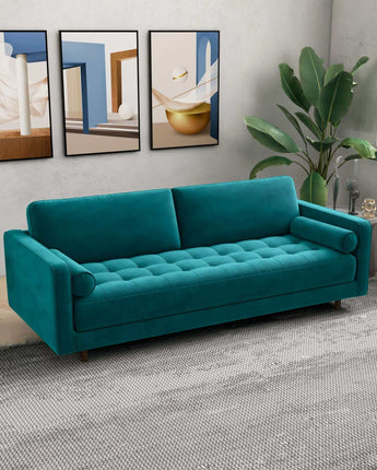 Anthony modern teal sofa with a sophisticated velvet texture.