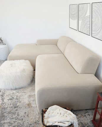 Close-up of the Mar Left Sectional Sofa in Cream, showcasing its soft upholstery.